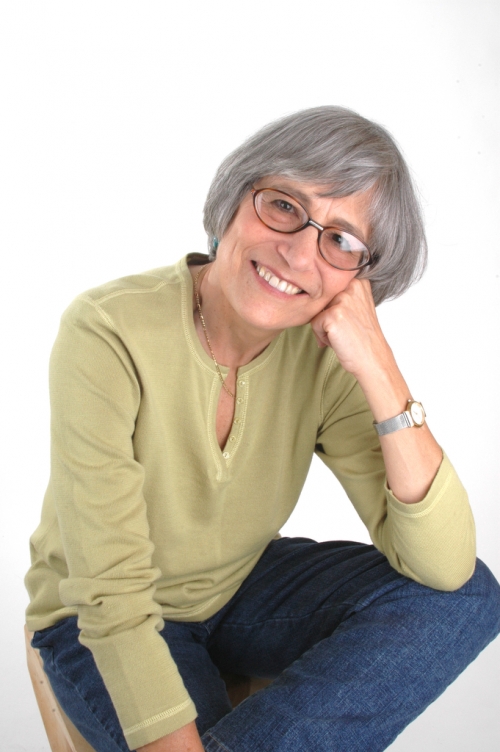 woman in glasses and a light green blouse
